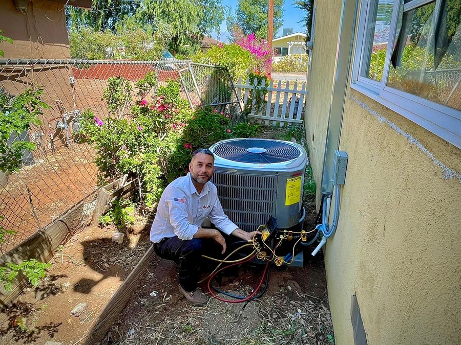 A Pon Air technician charging a newly installed outdoor condenser unit.